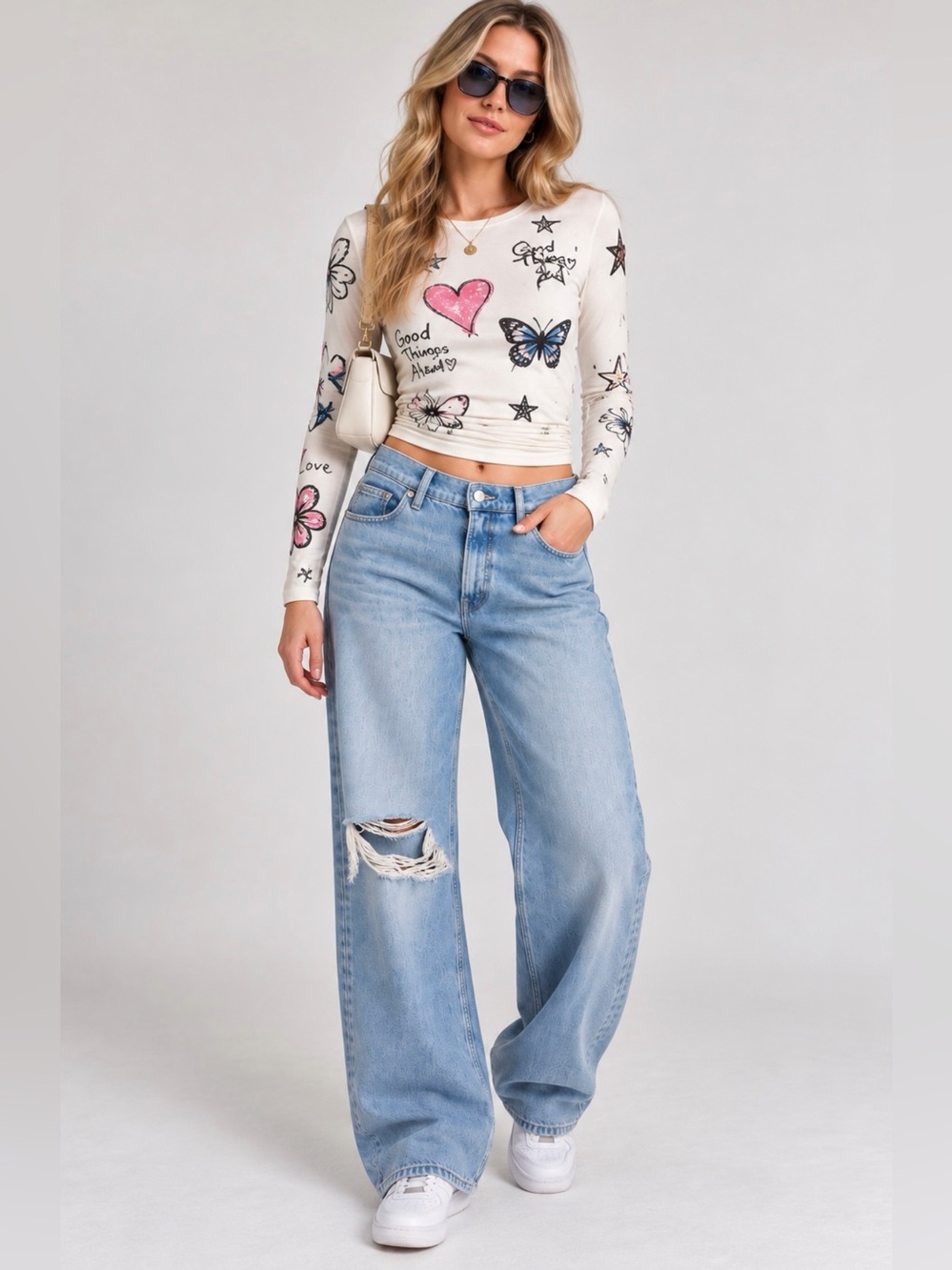 Good American Light Blue High-Rise Wide Leg Jeans with Distressed Knee
